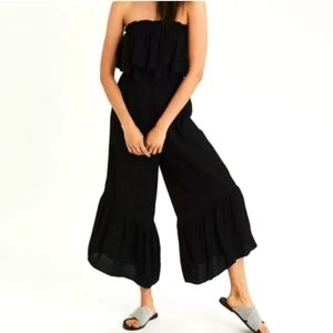 Strapless American Eagle Jumpsuit. Black with cream pinstriping. Size small.